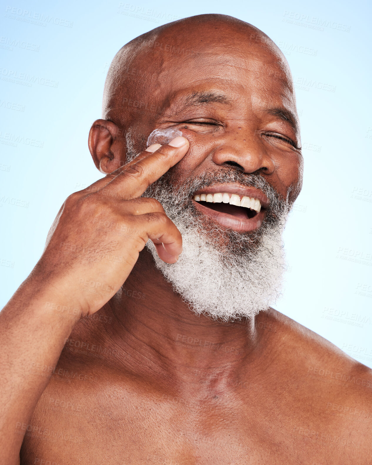 Buy stock photo Dermatology, hands and senior black man with cream in studio for skincare and wellness. Happy, African male person and healthy glow, shine and sunscreen by blue background for retirement or morning