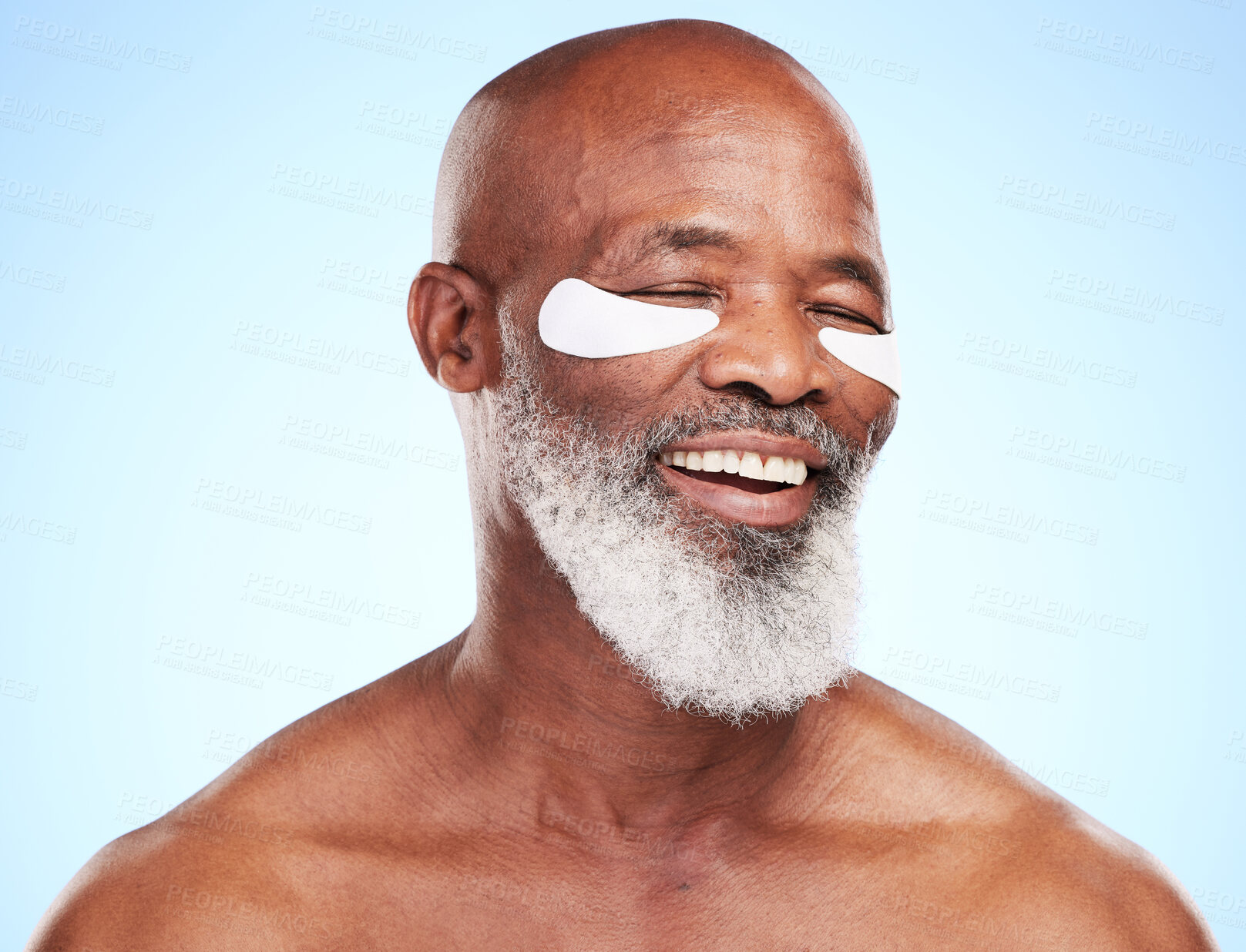 Buy stock photo Mature man, portrait and skincare in studio with eye mask for cleaning, smooth and skin moisturizer. Balck person, beauty and dermatology on blue background with patch for wellness or hyaluronic acid