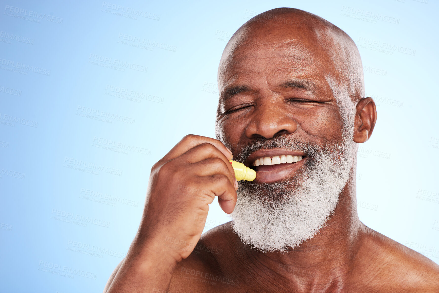 Buy stock photo Black man, lip balm and cosmetics treatment in studio, senior wellness and blue background. Elderly person, grooming and product for skincare, application and moisturizing tube stick for dermatology 