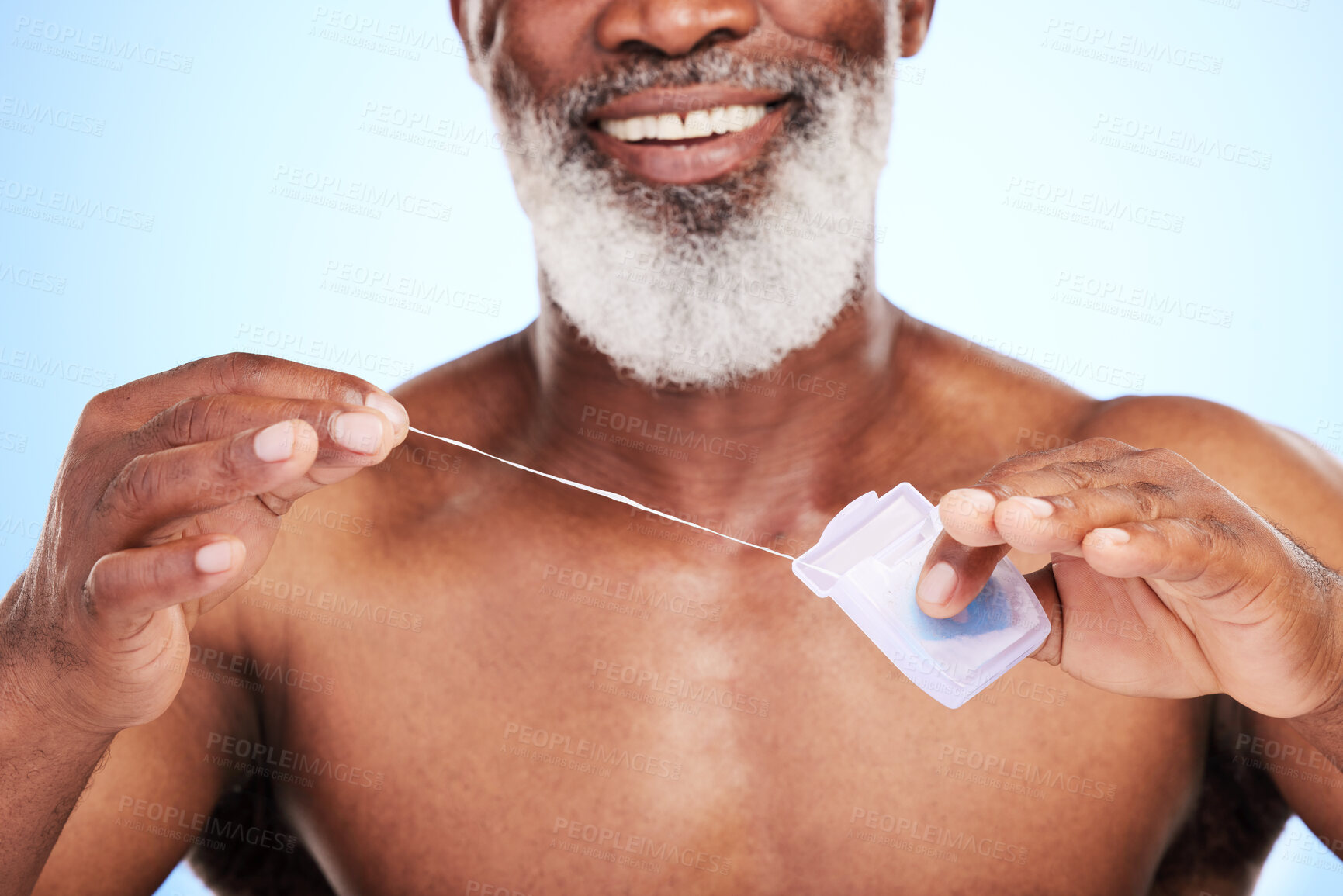 Buy stock photo Black man, smile and grooming in studio with floss for cleaning teeth, dental or fresh breath. Mature person, happy and oral care on blue background with mouth hygiene for wellness, white or bacteria