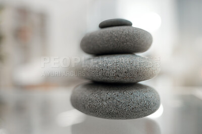 Buy stock photo Shot of a pile of hot stones on a table in an empty room