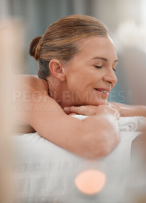 Buy stock photo Spa treatment, calm or mature woman on bed for massage, physical therapy or luxury. Smile, eyes closed or female person in health resort for destress, peace or wellness in hotel for pamper or me time