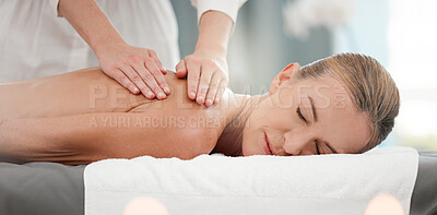 Buy stock photo Shot of a mature woman receiving a back massage at a spa
