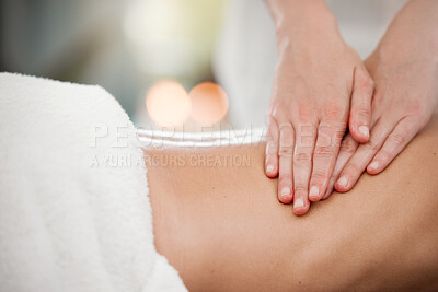 Buy stock photo Shot of a woman receiving a back massage at a spa