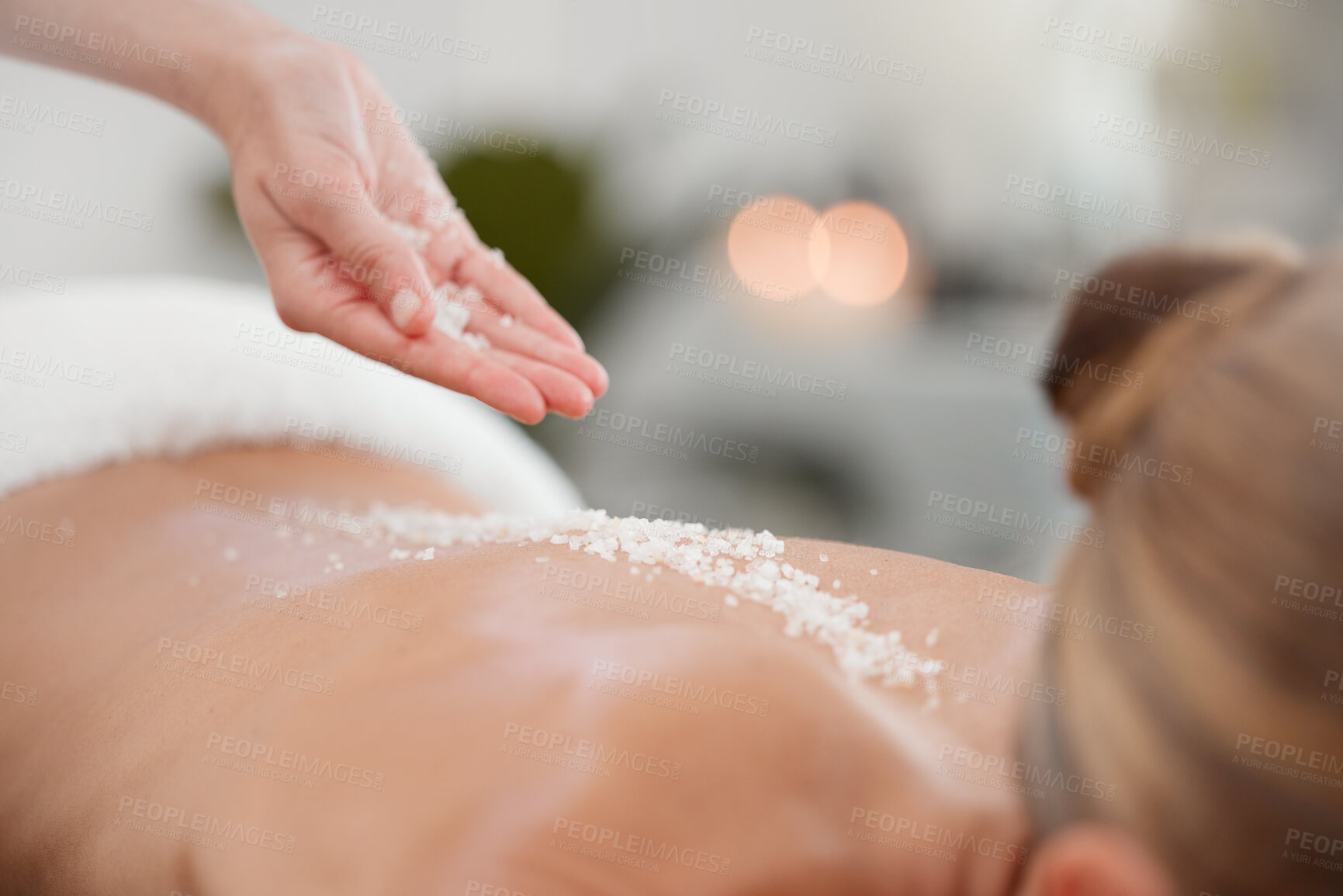 Buy stock photo Beauty salon, back and hands with salt for massage with body scrub, exfoliating and cosmetic treatment. Skincare, wellness therapist and client for natural detox, glowing skin and dermatology at spa