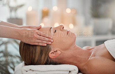 Buy stock photo Shot of a woman receiving a temple massage at a spa