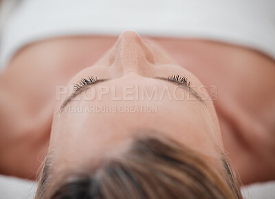 Buy stock photo Shot of a woman lying down and resting at a spa