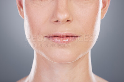 Buy stock photo Studio shot of an unrecognisable woman posing against a grey background