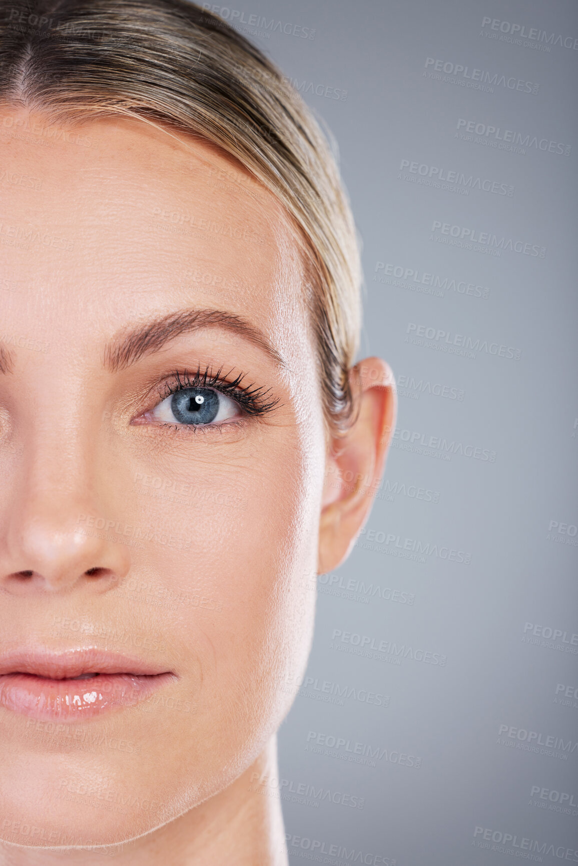 Buy stock photo Studio portrait of an attractive mature woman posing against a grey background