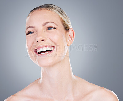 Buy stock photo Studio shot of an attractive mature woman posing against a grey background