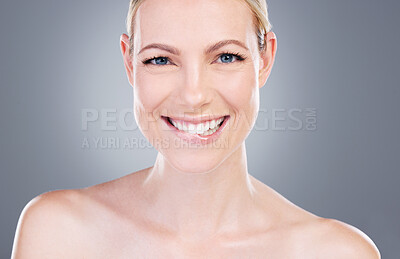 Buy stock photo Studio portrait of an attractive mature woman posing against a grey background