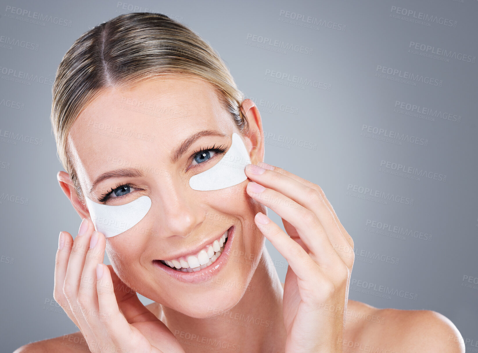 Buy stock photo Skincare, portrait and happy woman with eye pad, cosmetics or facial treatment product in studio mockup. Beauty, dermatology and girl with collagen patches for healthy skin routine on grey background