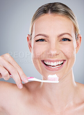 Buy stock photo Happy woman, portrait and toothbrush for dentistry in studio, cosmetics and hygiene on gray background. Female person, dental health and teeth for oral care, confidence and orthodontics healthcare