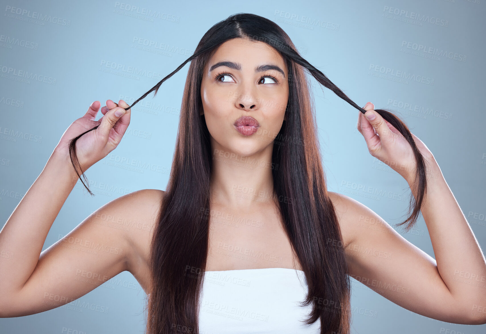 Buy stock photo Hair care, woman and shine with dermatology, thinking or texture on blue studio background. Person, shampoo or model with fun, volume or grooming routine with aesthetic, growth or style with glow