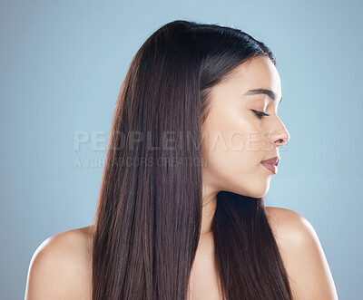 Buy stock photo Hair care, woman and profile with dermatology, shine or texture on blue studio background. Person, thinking or model with fun, volume or grooming routine with aesthetic, growth or cosmetics with glow