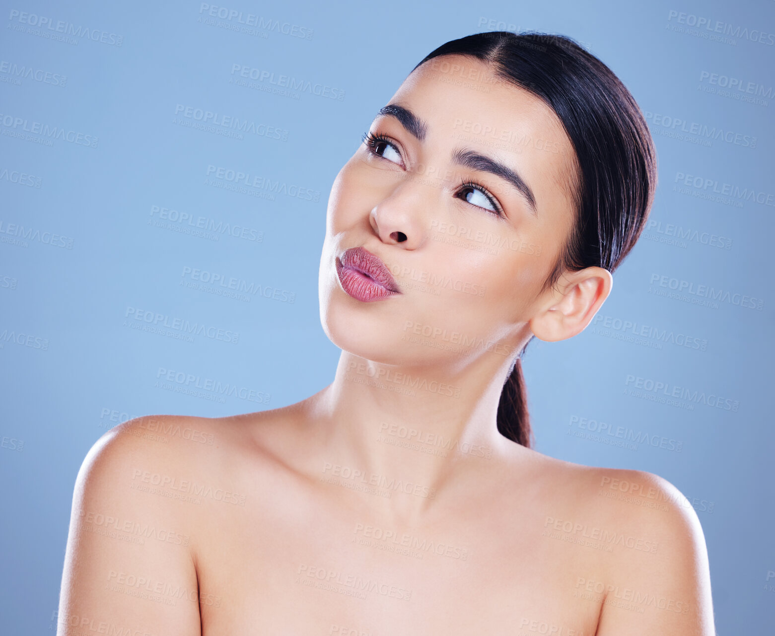 Buy stock photo Woman, thinking and skincare in studio for clean skin, cosmetics planning and blue background. Female person, ponder facial treatment and makeup transformation, dermatology and self care aesthetic