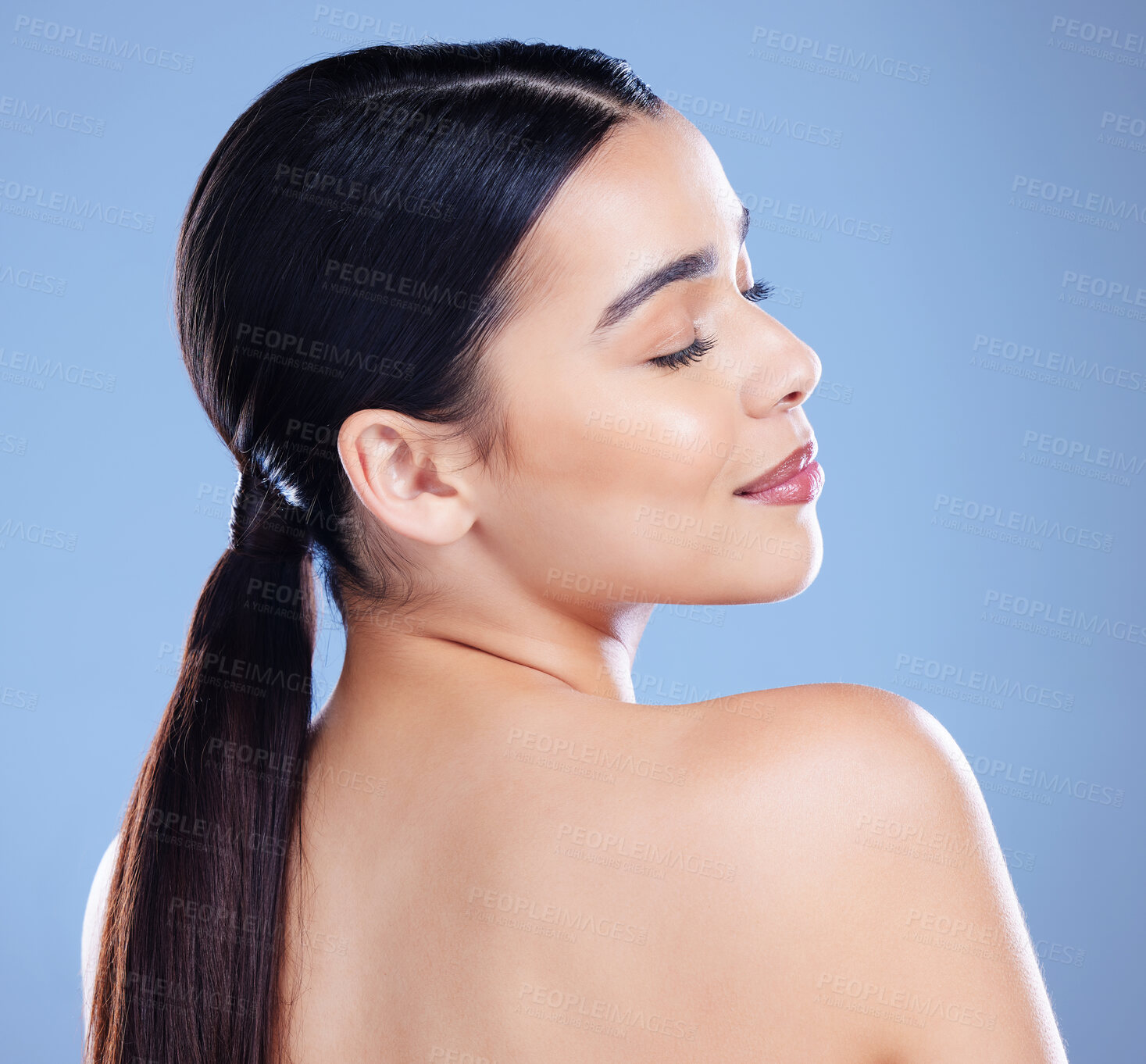 Buy stock photo Woman, shoulder and skincare in studio for clean skin, smooth cosmetics and blue background. Female person, spa body treatment and natural glow for wellness, dermatology and self care aesthetic