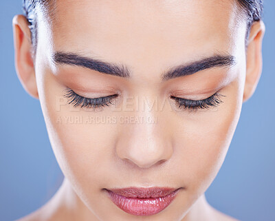 Buy stock photo Skincare, face and woman in studio with natural, health and facial routine for hydration. Beauty, wellness and calm female person with dermatology treatment for collagen glow by blue background.