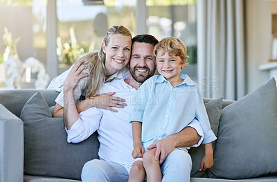 Buy stock photo Cropped portrait of an affectionate mature couple and their son relaxing in the living room at home