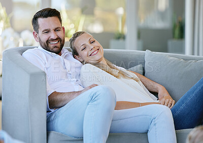 Buy stock photo Cropped shot of an affectionate mature couple relaxing in the living room at home