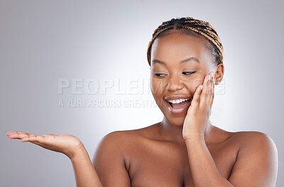 Buy stock photo Black woman, palm and cosmetics in studio with space for mock up with smile by white background. Girl, model or person with open hand for beauty, skincare and promotion with facial transformation