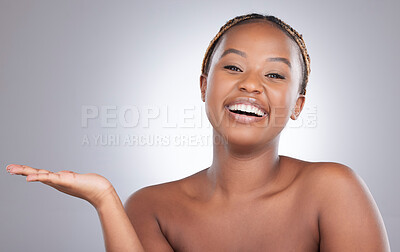 Buy stock photo Black woman, open hand and cosmetics in studio portrait with space for mockup with smile by white background. Girl, model and person with palm, happy and natural beauty with facial transformation