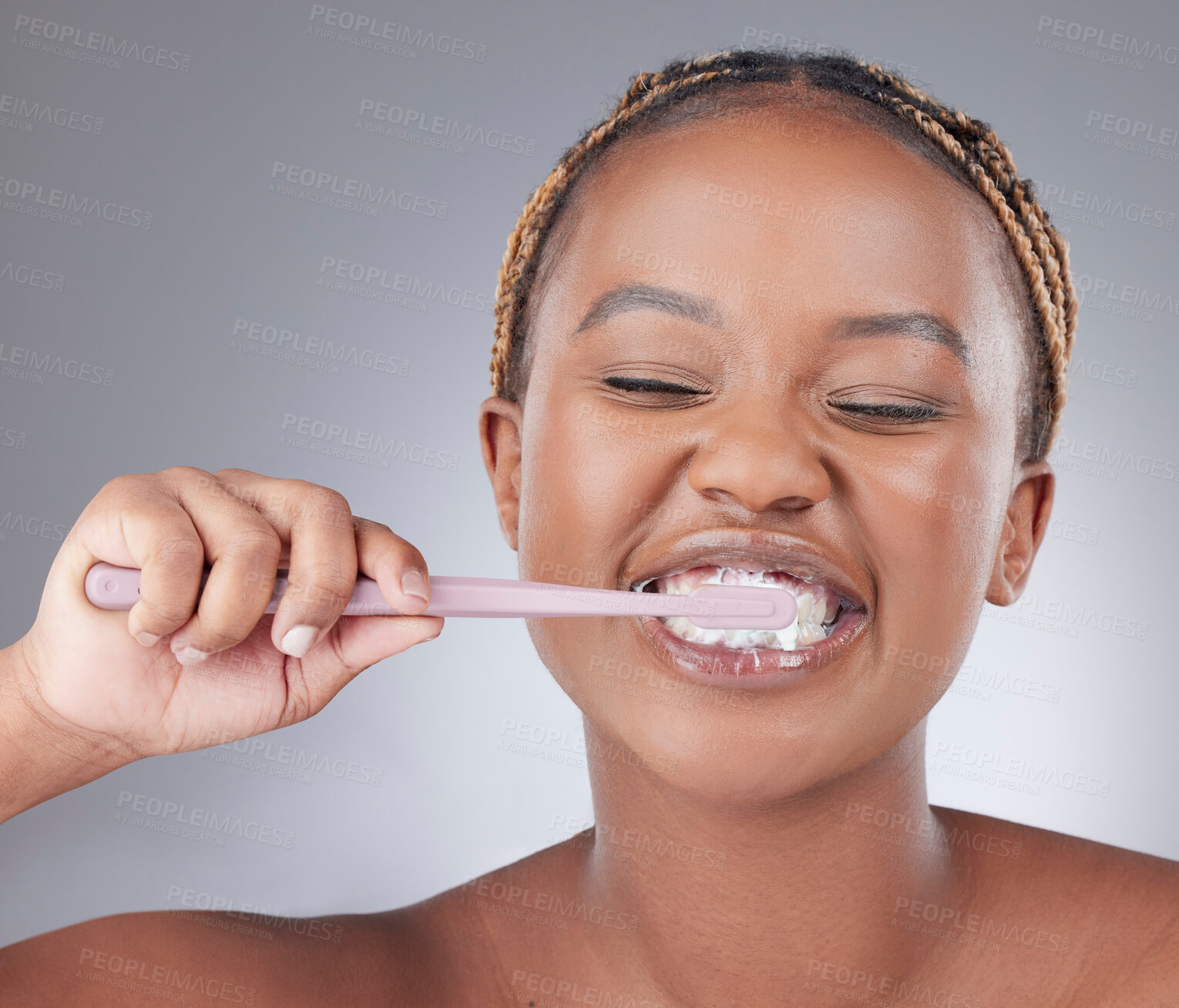 Buy stock photo African woman, brushing teeth and studio with smile, foam and oral wellness by white background. Girl, model and person with plastic toothbrush with toothpaste, health and cleaning mouth for routine