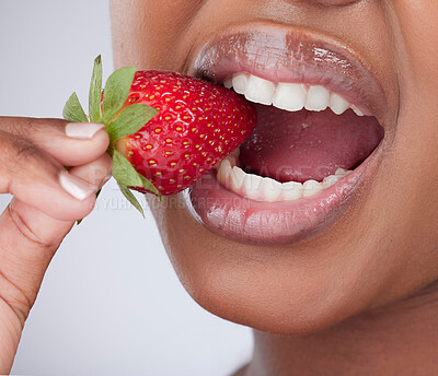 Buy stock photo Strawberry, health and mouth of woman in studio for healthy eating, wellness and wellbeing. Food, diet and lips of person with fruit for nutrition, lose weight and vitamins on white background