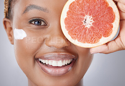 Buy stock photo Face cream, skincare and portrait of black woman with grapefruit for beauty, wellness or facial. Dermatology, fruit and person with moisturizer for vitamins, health and nutrition on studio background