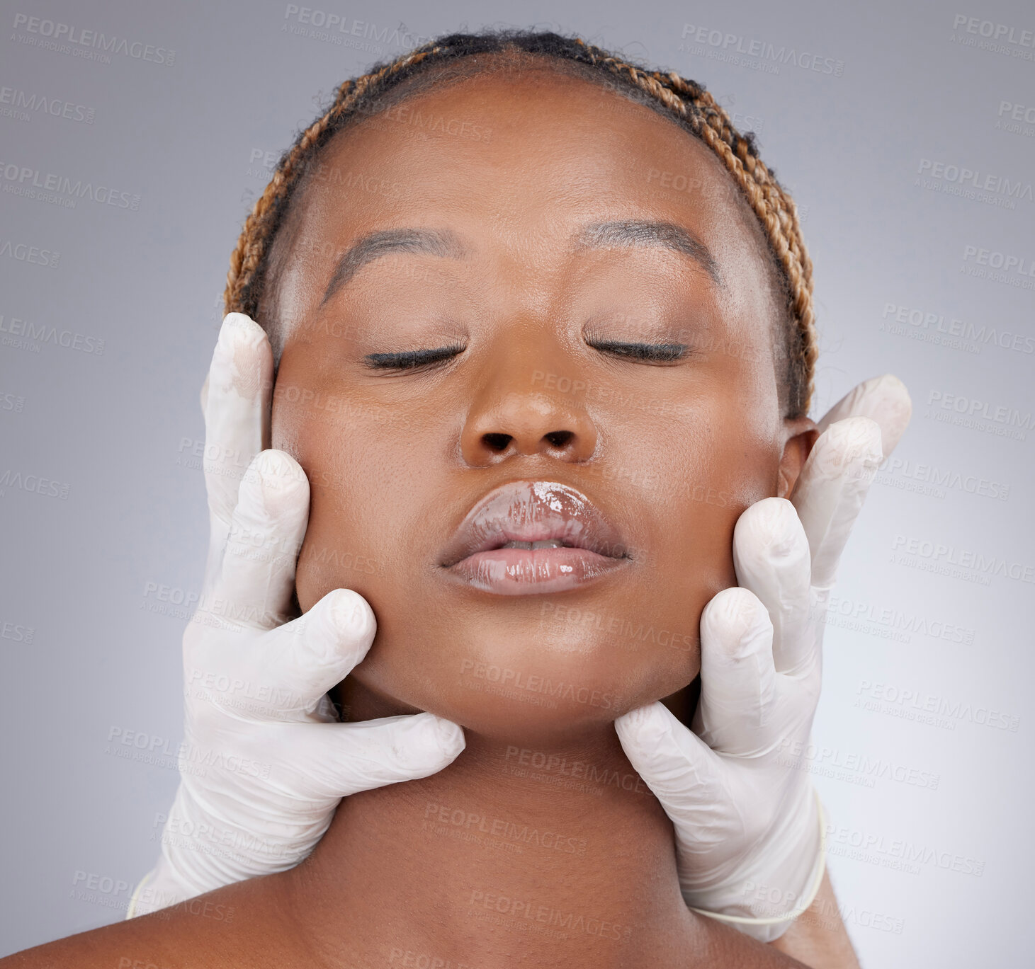 Buy stock photo Plastic surgery, woman and face with gloves in studio for skincare consultation and routine check for procedure. Black person, expert and facial inspection for cosmetics implant on gray background