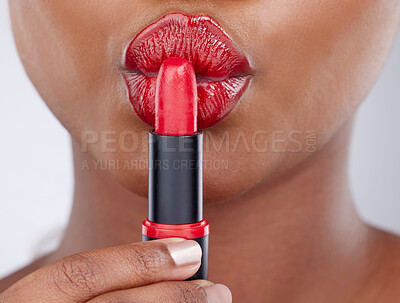 Buy stock photo Beauty, kiss and woman in studio with lipstick for cosmetics products, makeup and skincare. Cosmetology, pout and closeup of mouth of person with lipgloss, shine and red color on white background