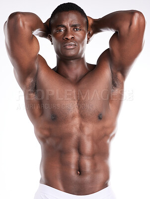 Buy stock photo Portrait of a handsome young man posing shirtless against a white background