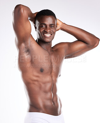 Buy stock photo Portrait of a handsome young man posing shirtless against a white background