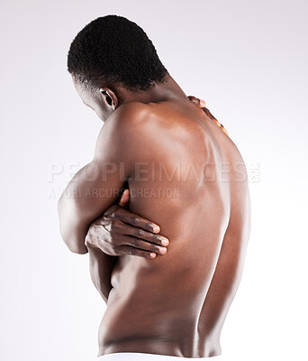 Buy stock photo Black man, back and self love in studio with body, skincare and wellness with embrace on white background. Muscular model, comfort and affection with caring arms or hugging, health and appreciation
