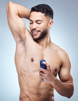 Buy stock photo Man, underarm and spray for skincare in studio, cosmetic and odour control or deodorant for body hygiene. Happy, model wellness and fresh grooming on background, spraying and scent or smell product