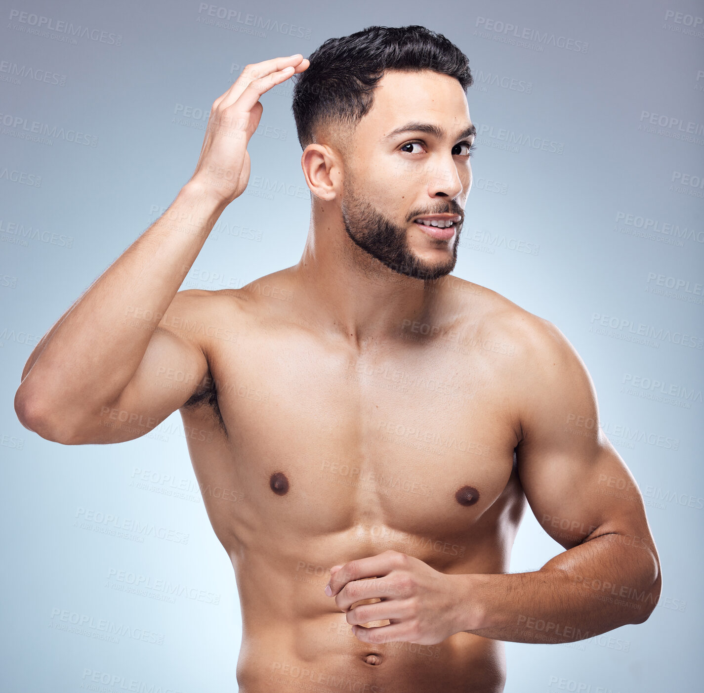 Buy stock photo Beauty, hands and man fixing hair for morning routine with healthy or clean scalp and texture in studio. Model guy, check hairstyle and growth for wellness and barbershop aesthetic by grey background