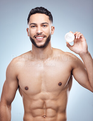 Buy stock photo Skincare, portrait and man with face cream jar for clean beauty and shine results for healthy glow in studio. Model guy, dermatology and sunscreen container with moisture benefits by gray background