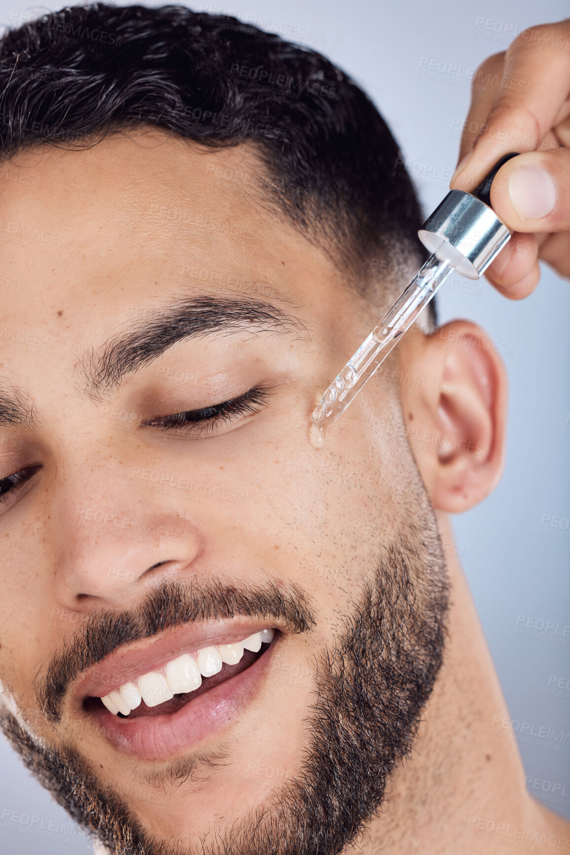 Buy stock photo Skincare, man and facial oil for beauty with natural glow or shine results in studio. Male person, dermatology and hyaluronic acid serum for acne scar treatment and healthy beard by gray background
