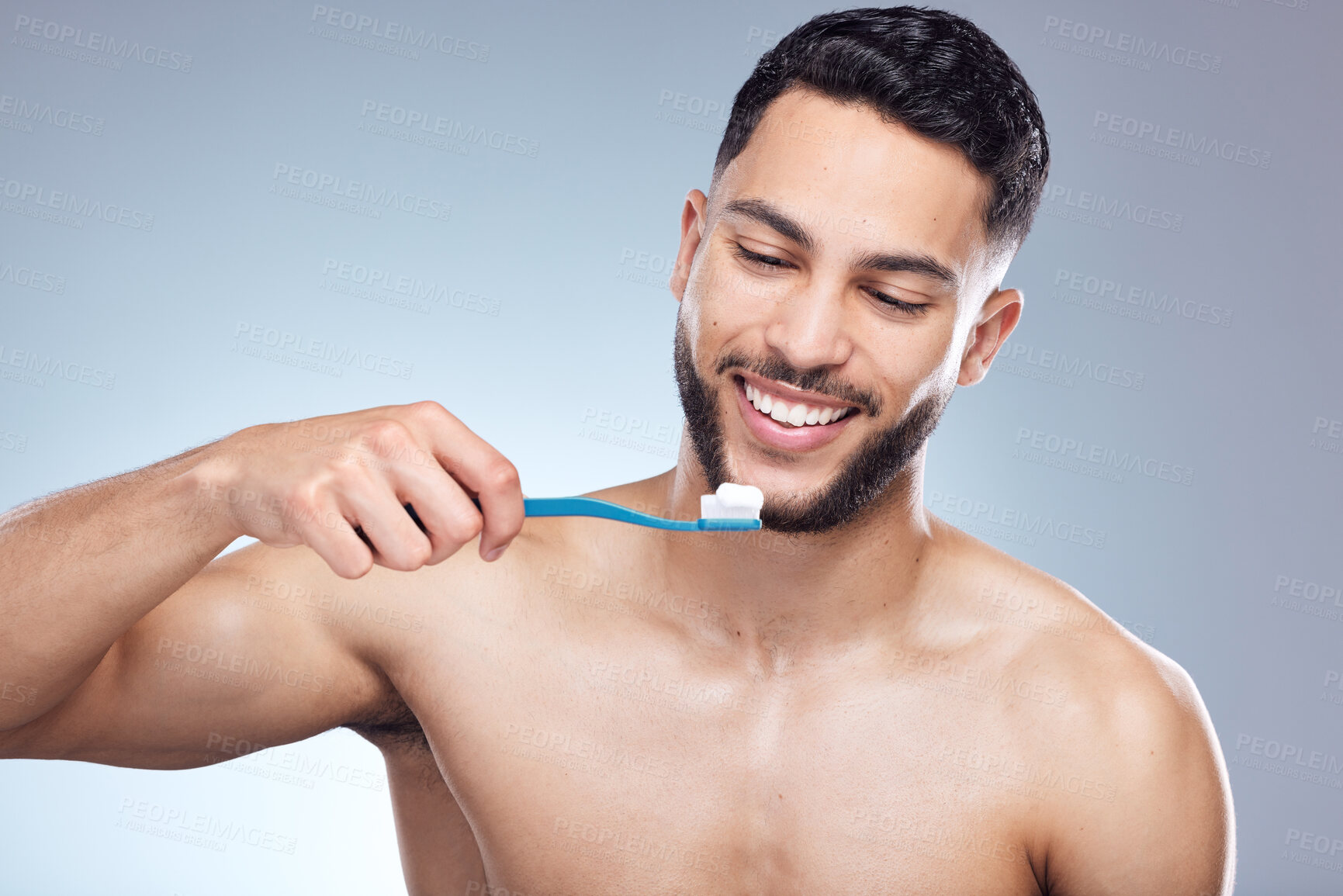 Buy stock photo Man, face and happy with brushing teeth in studio for oral hygiene, mouth cleaning and morning routine. Dental, person and toothbrush for fresh breath, plaque and healthy gums on white background