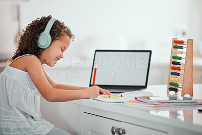 Buy stock photo Shot of a little girl doing homework at home