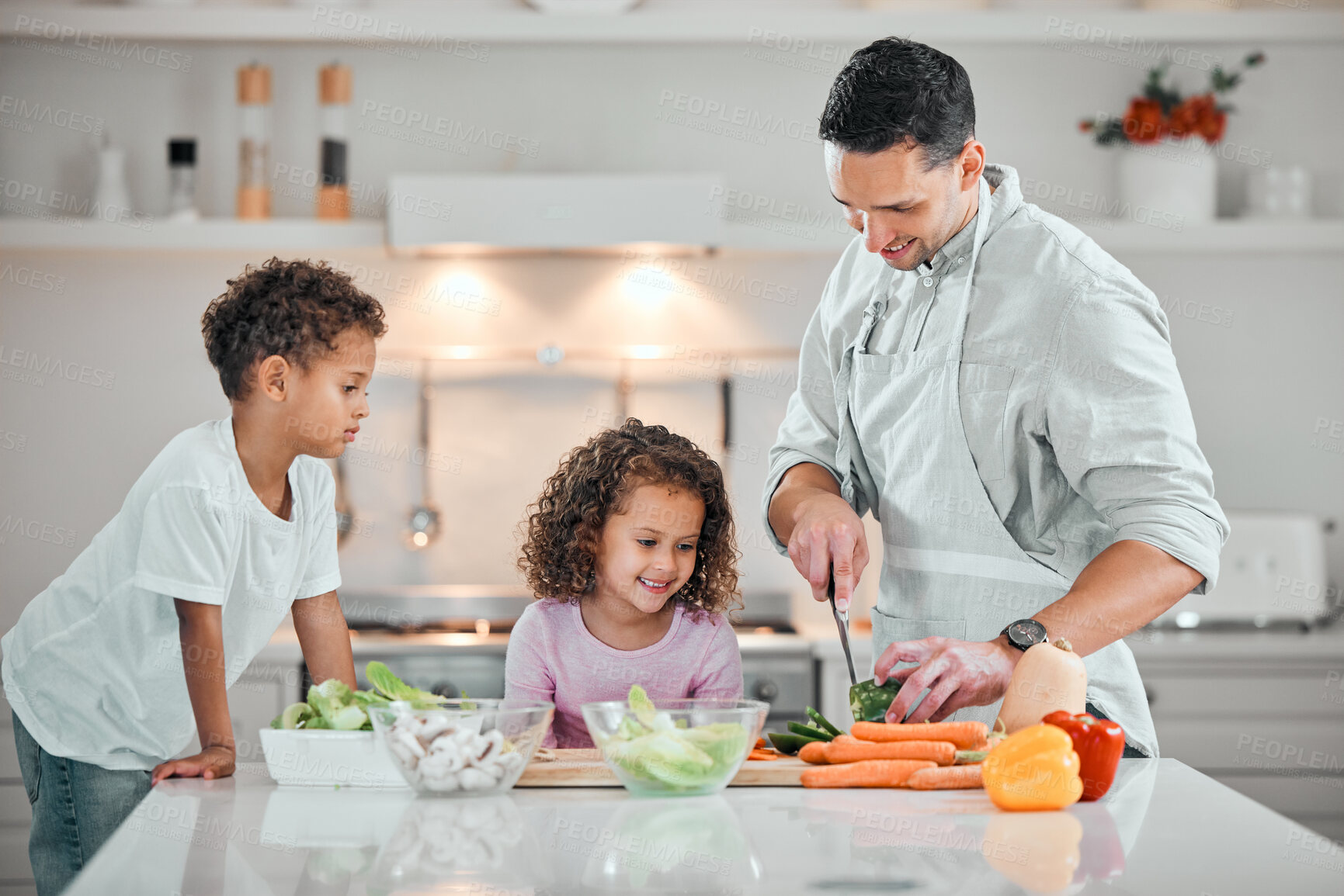 Buy stock photo Cooking, help and salad with family in kitchen for health, nutrition and food. Diet, support and dinner with man and children cutting vegetables at home for wellness, meal prep and learning