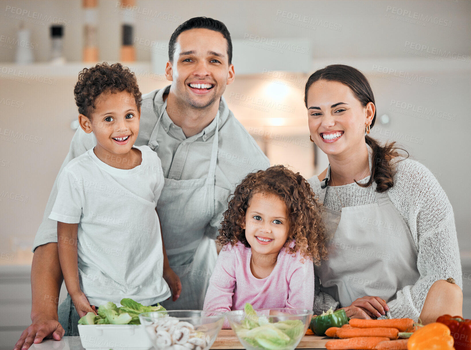 Buy stock photo Cooking, help and portrait of family in kitchen for health, nutrition and food. Diet, vegetables and dinner with parents and children with meal prep at home for wellness, organic salad and learning