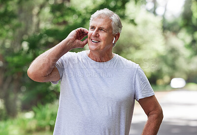 Buy stock photo Thinking, music and man with earphones while running,  fitness motivation and exercise audio. Ready, smile and a senior person laughing while listening to a podcast at a park for cardio and workout