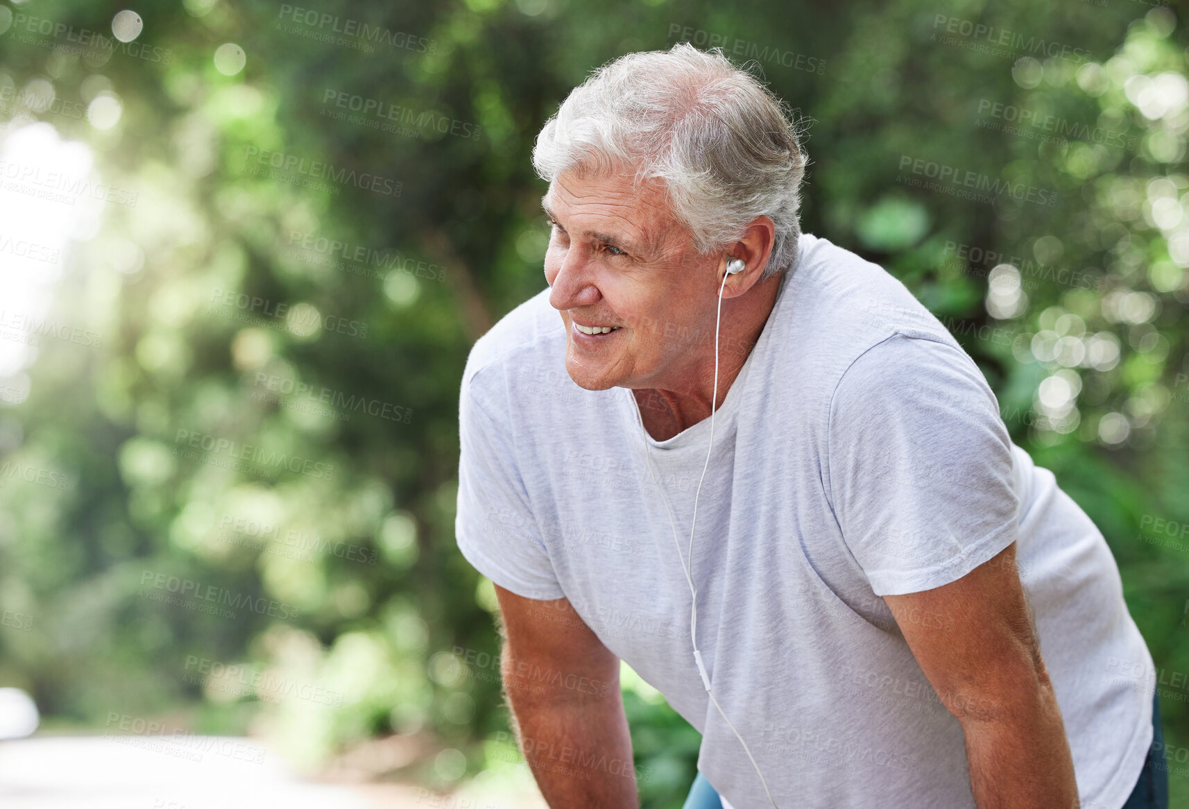 Buy stock photo Senior man, tired and outdoor with music earphones for run, workout and training on road for fitness. Elderly male person happy about cardio exercise for health and wellness on running, rest or break