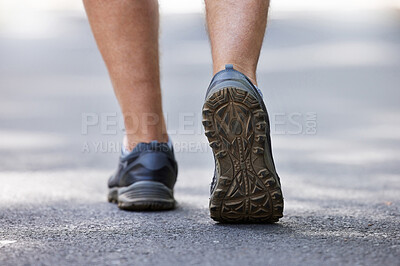 Buy stock photo Fitness, shoes and walking with a man on a street during a cardio or endurance workout outdoor. Back, exercise and health with a male runner or athlete training on a street for wellness or lifestyle