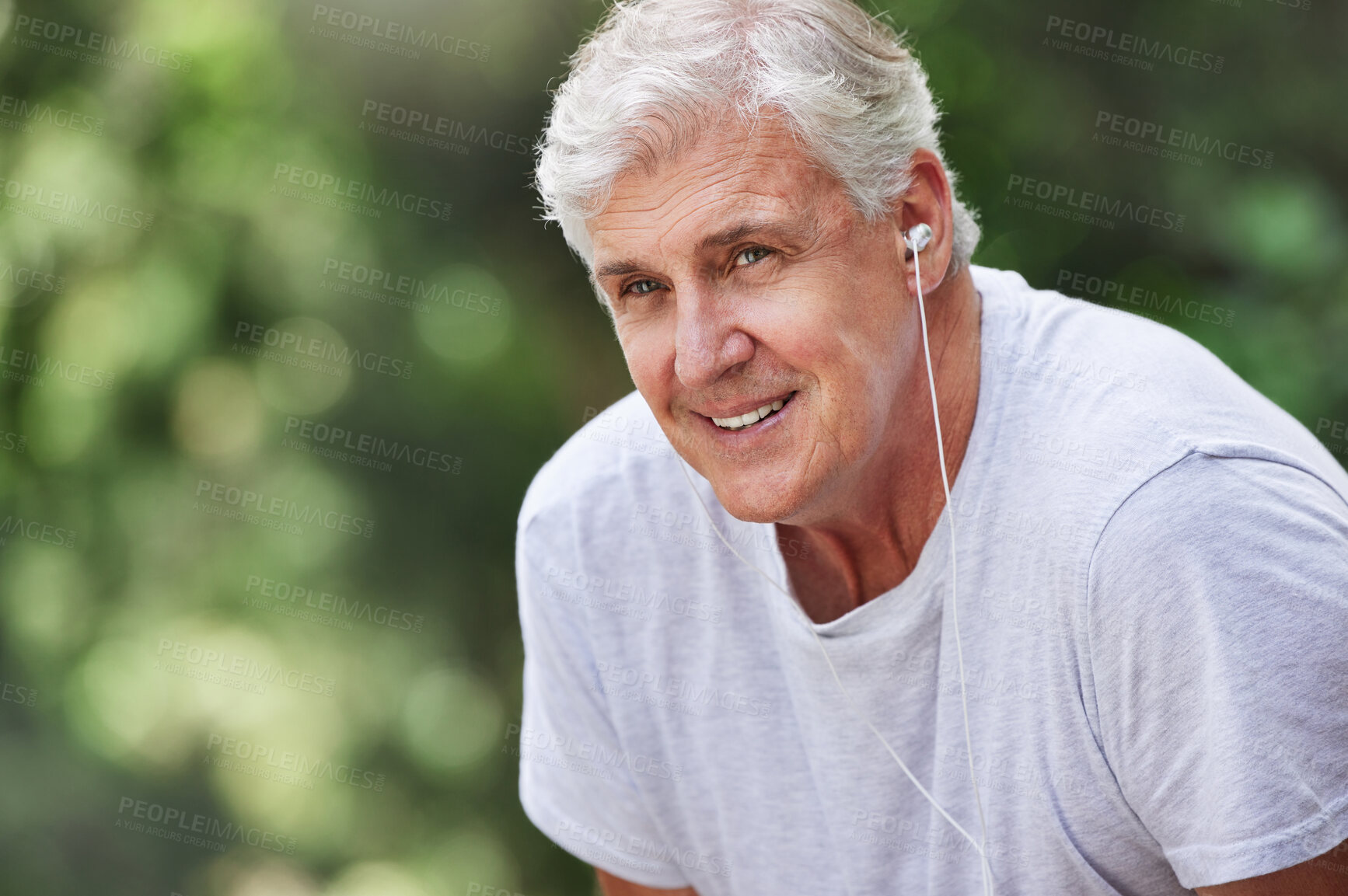 Buy stock photo Senior man, exercise and outdoor with music earphones for run, workout and training for fitness. Elderly male happy on break, rest and tired thinking of cardio audio for health and wellness in nature