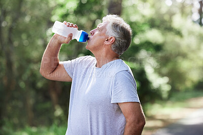 Buy stock photo Man, exercise and outdoor drinking water for a run, workout and training for fitness. Senior male person with bottle for hydration, cardio health and wellness while running in nature and retirement