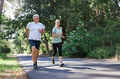 Buy stock photo Fitness, senior and a couple running in a park for cardio, retirement exercise and movement. Happy, morning and an elderly man and woman jogging for health, training and active together in nature