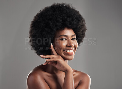 Buy stock photo Beauty, skincare and portrait of happy woman with afro, cosmetics and dermatology on grey background. Natural skin care, studio and African model with smile on face, salon makeup glow and wellness.
