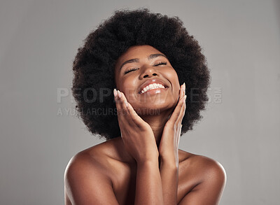 Buy stock photo Beauty, skincare and happiness, black woman with afro and cosmetics in studio on grey background. Natural skin care, dermatology and African model with smile on face, salon makeup glow and wellness.